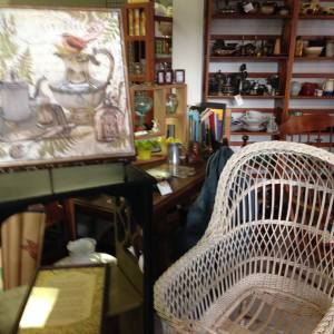 Wicker baby basket and shabby chic art.