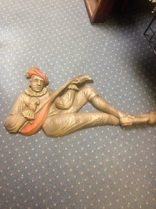 Our Jester (or Lutist) is about 38" wide by 21" high. Made of molded plastic.