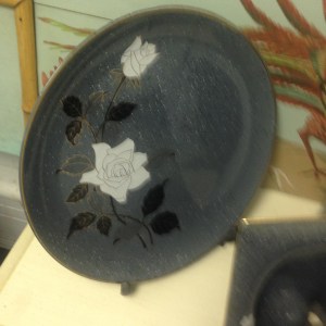 This lovely dresser set consists of a decorative plate, a picture frame, a tall vase and a small covered pot. The pictures don't do the colors justice. 